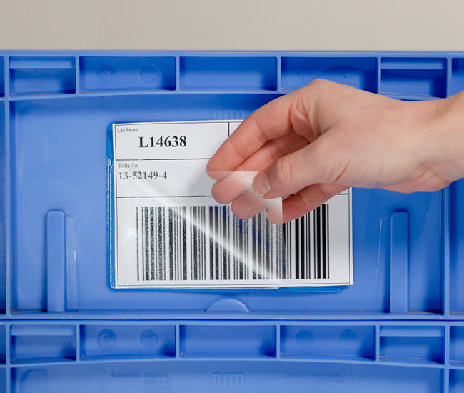 Self-adhesive pockets for plastic boxes